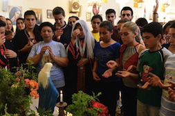 Young Syrians at prayer