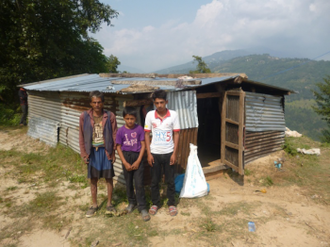 Nain and his sons with their new 'palace'