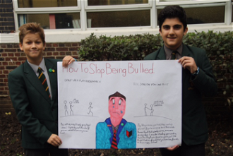 Year 8 Pupils with one of their posters