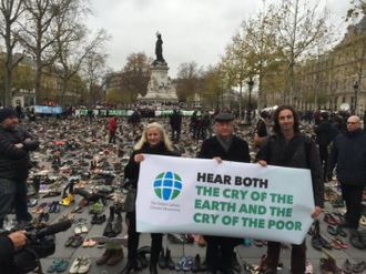 Cardinal Hummes with campaigners by the shoe display