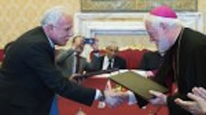 Dr Riad Malki, Minister of Foreign Affairs of the State of Palestine, with Archbishop Paul Richard Gallagher representing the Holy See,  at signing ceremony in June