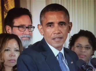 Obama with some relatives of those killed in mass shootings recently