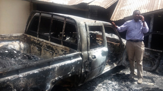 Diocesan worker with wrecked truck