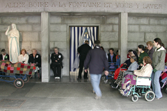 Pilgrims enter the steaming baths