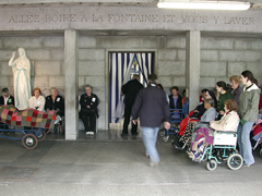 Pilgrims enter the steaming baths