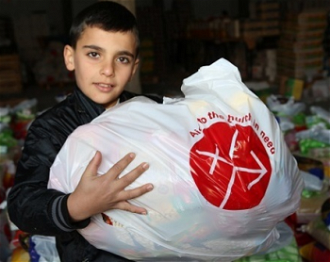 Iraqi Christian boy with ACN supplies