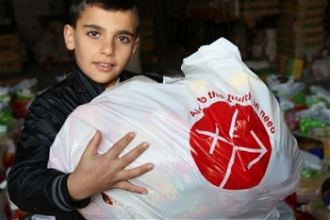 Iraqi Christian boy with ACN supplies