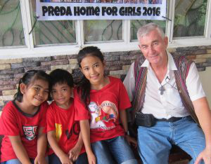 Fr Shay with some of the rescued children
