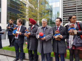 Leaders of five London councils who are accepting children were presented with a Paddington bear who in the story arrives in London alone to be looked after by strangers