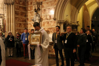 Fr Benoit carries reliquary