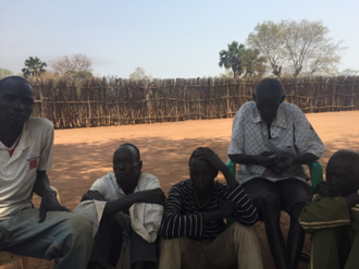 Sitting listelessly - Santino Matwili (right) is losing his sight because of malnutrition