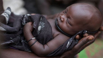 Baby Akou Marial was born under a tree in Lakes State, South Sudan where her family has sought temporary refuge. [image: Sara Fajardo/CRS]