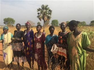Women in Yirol, South Sudan, with only leaves to feed children