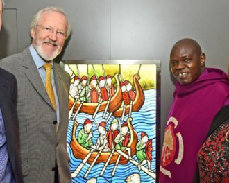 Archbishop Sentamu (rt) and David Jennings with stained-glass window