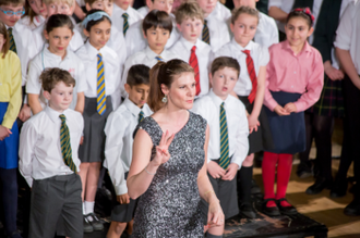 Voces8 soprano Andrea Haines with young singers