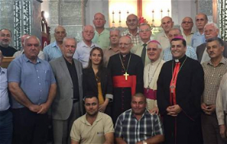 Mayor Zara is next to Chaldean Patriarch Louis Raphael Sako