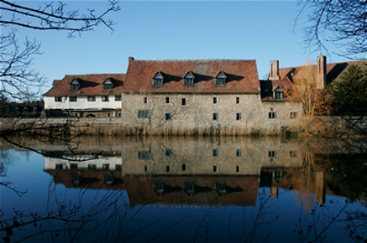 The beautiful medieval Pilgrims' Hall at The Friars, seen from across the River Medway.