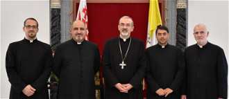 Archbishop Pizzaballa, (centre) with (left to right)  Fr George Ayoub, Fr  Ibrahim Shomali and Fr Joseph Sweiss