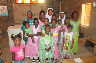 Sisters with young people in Markoy, Dori Diocese
