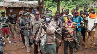 Menacing sight - militia outside seminary image: Bishop Munoz