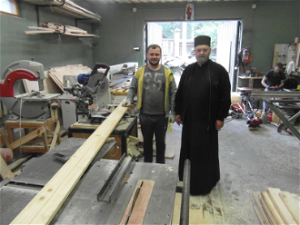 Fr Belkov and member of centre in Sapernoye with new carpentry machine funded by ACN.
