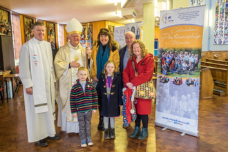 Fr Kevin O'Neill and Archbishop  Bernard Longley with the Tierney Family