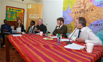 Fr. Padraig Devine addressing an inter-tribal meeting observed by Minister of State Joe McHugh