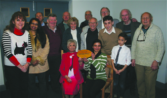 Knights with their families and their Live Simply plaque. Photo by Ian Burden