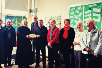 Fr Godric Timney and Paul Kelly with St Anne's hard-working parishioners and their livesimply award