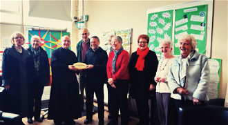 Fr Godric Timney and Paul Kelly with St Anne's hard-working parishioners and their livesimply award