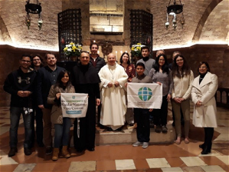 Bishop of Assisi, Archbishop Domenico Sorrentino, Fra Mauro Gambetti, custodian of the Sacro Convento of Assisi, with GCCM staff members after Mass at St Francis' tomb