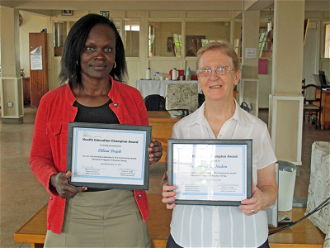 Sr Bernadette Nealon and Lillian Dajoh with awards