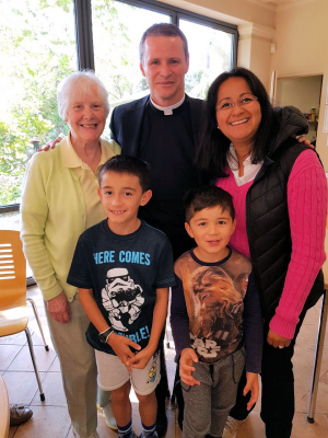 Fr Philip with Clare Richards and her family