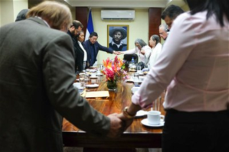 Moment of prayer - delegation with president of national assembly. ©Sean Hawkey/WCC