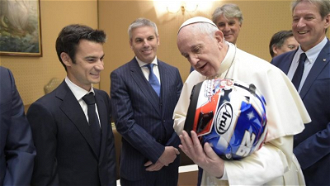 Pope chats with racing drivers