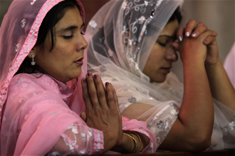 Women praying in Lahore church