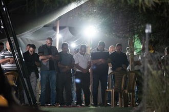 People gather for evening prayer in Khan al Ahmar, October 2018. Photo: Albin Hillert/WCC