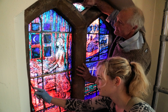 Elizabeth Hippisley-Cox, Thomas Denny installing one window. Image: Keith Morris/rcdea.org.uk