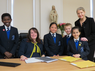 From left to right: Joene, Head Boy, Mrs Titus, Headmistress, Harriette, Kacper, Jennifer, Head Girl and Ms Kirby, Deputy Head.