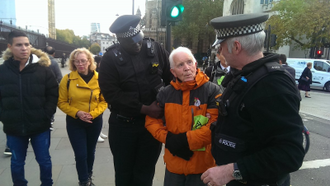 Phil Kingston is led away by police