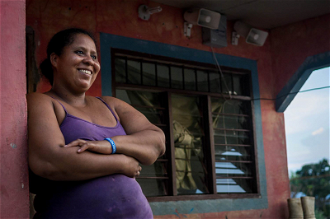 Community leader Maricela Jimenez by her home in El Guayabo