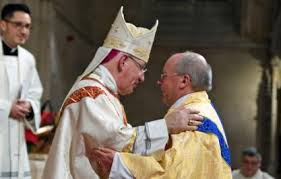 Bishop Moth and Fr Lusted exchange sign of peace during the ordination service