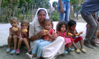 Sister feeding Venezuelan children