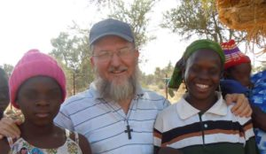 Missing Fr Maccalli with parishioners last year