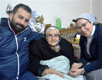 ACN project partner Sr Annie Demerjian with Lucine,  85, from Aleppo, Syria, and volunteer Fadi. © Aid to the Church in Need