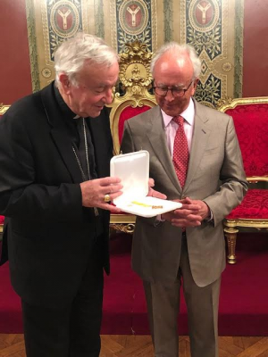 Cardinal presents Benemerenti medal to Michael Milbourn