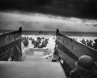 Company E, 16th Infantry, 1st Infantry Division wading onto  Fox Green section of Omaha Beach image: NAID 195515.