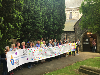 Love Knows No Boundaries banner at St Margaret of Antioch's church near Dover's White Cliffs