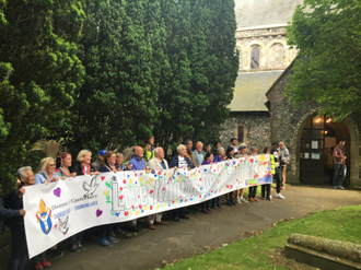 Love Knows No Boundaries banner at St Margaret of Antioch's church near Dover's White Cliffs