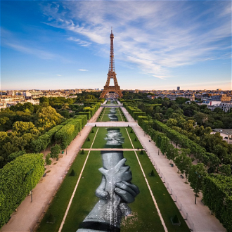 Beyond Walls by Saype (born 1989), Biodegradable spray paint on grass, 2019, © Saype installation, Champ de Mars, Eiffel Tower, Paris, France
